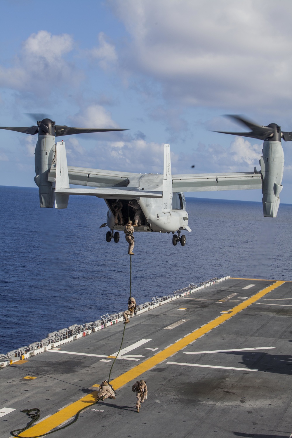 Marines practice fast roping on ship