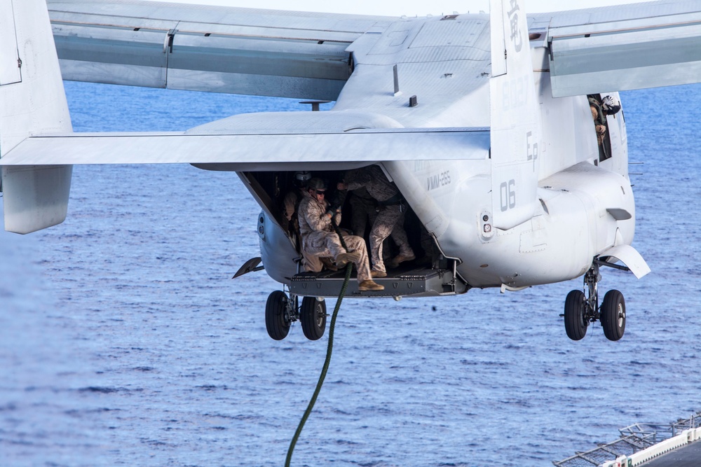 Marines practice fast roping on ship