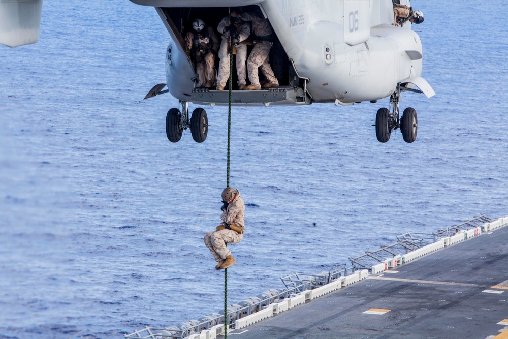 Marines practice fast roping on ship