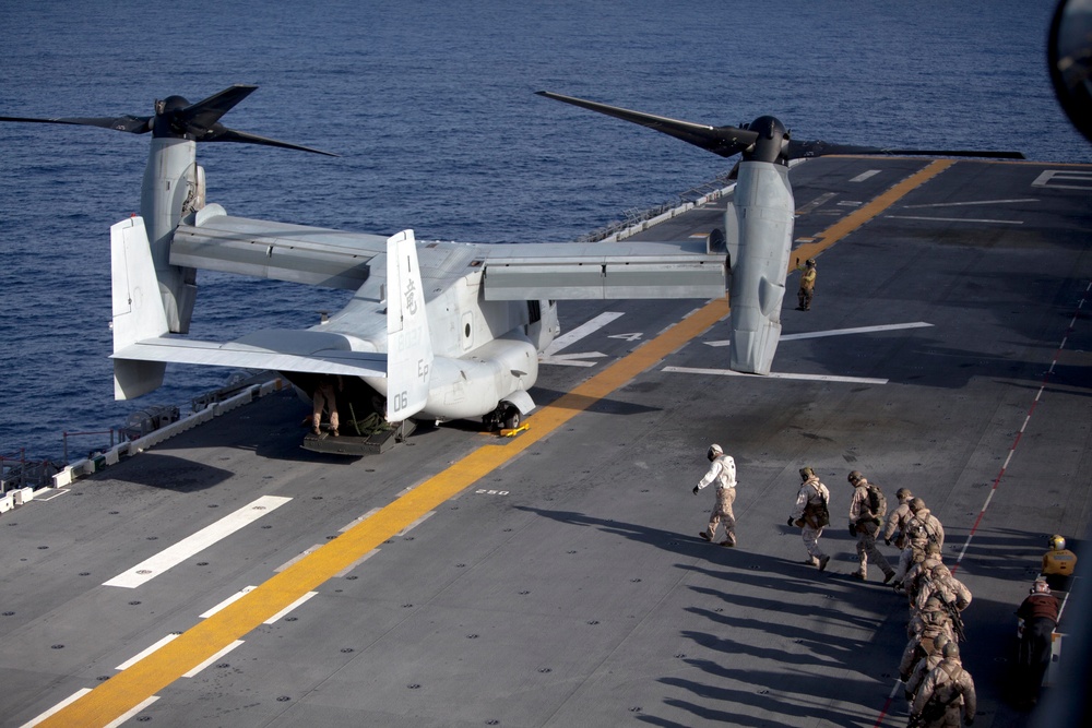 Marines practice fast roping on ship