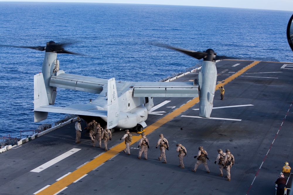 Marines practice fast roping on ship