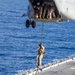 Marines practice fast roping on ship