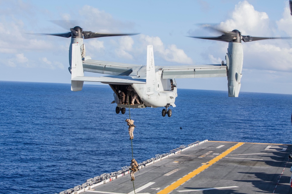 Marines practice fast roping on ship