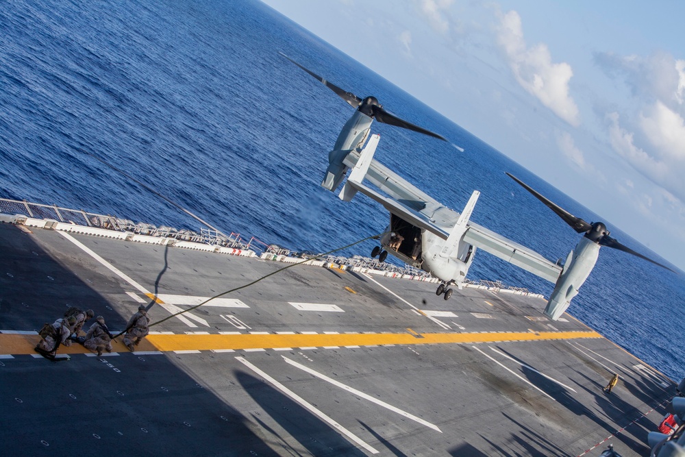 Marines practice fast roping on ship