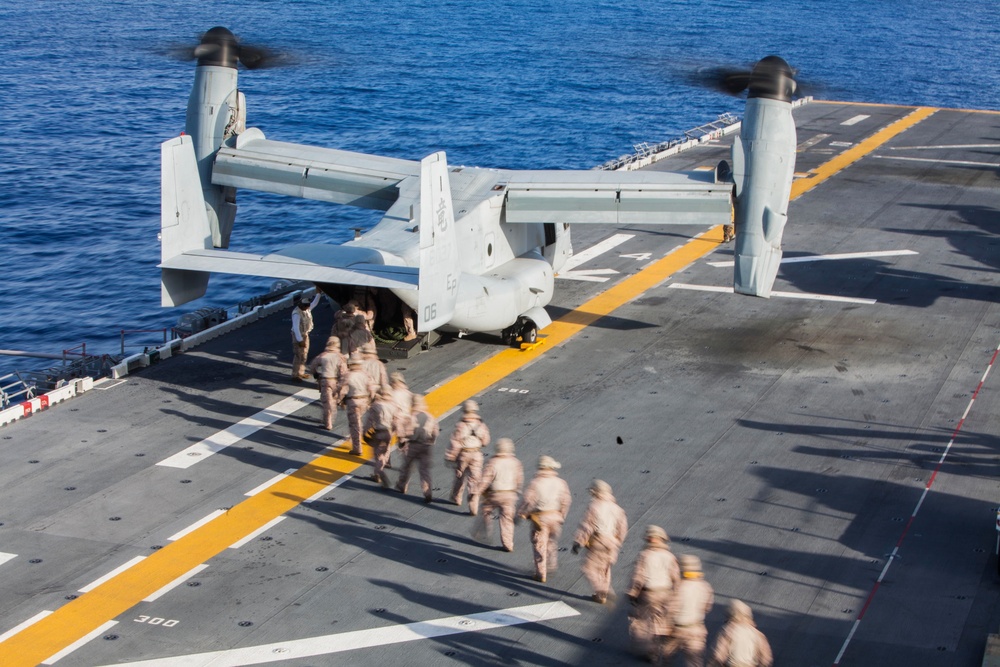 Marines practice fast roping on ship