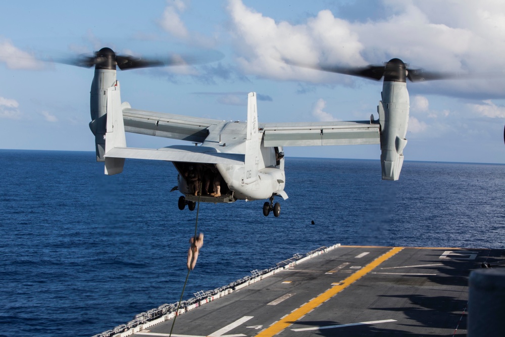 Marines practice fast roping on ship