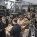 U.S. Marines pitch in during replenishment at sea