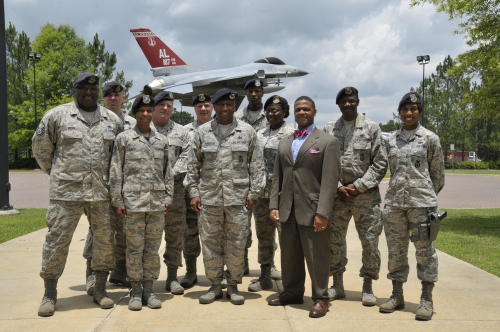 187th Fighter Wing SF members take group photo with 'Top Cop'