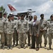 187th Fighter Wing SF members take group photo with 'Top Cop'