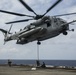 U.S. Marines fast rope from CH-53E Super Stallion at Sea