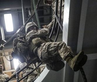 U.S. Marines fast rope aboard USS San Antonio