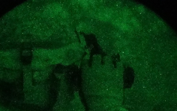 Soldier adjusts NVGs before air assault