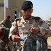 Iraqi army soldiers receive equipment, weapons