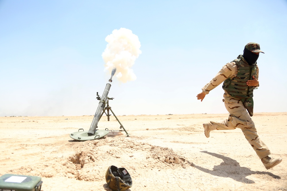 Iraqi army soldiers conduct training, receive equipment, weapons