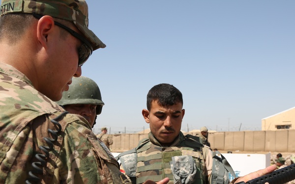 Iraqi army soldiers conduct training, receive equipment, weapons