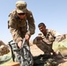 Iraqi army soldiers conduct training, receive equipment, weapons