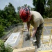 Bond beam work at Gabriela Mistral School construction site