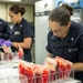 USNS Mercy medical personnel prepare simulated blood for mass casualty drill