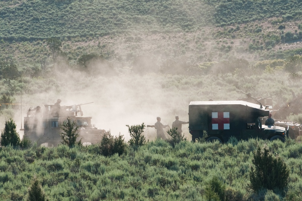 Competitors sweat their way through the Skills Stations/Land Navigation event during the 2015 ARNG Best Warrior competition, June 24