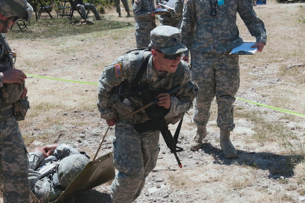 Competitors sweat their way through the Skills Stations/Land Navigation event during the 2015 ARNG Best Warrior competition, June 24