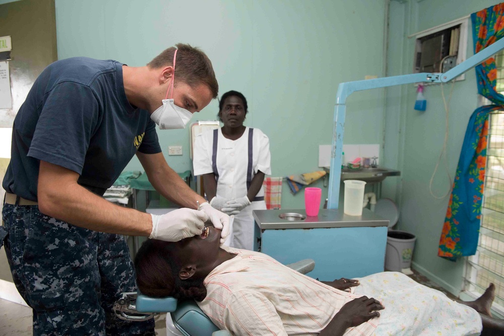 Dental screening people in Arawa, Papua New Guinea, for Pacific Partnership 2015