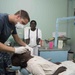 Dental screening people in Arawa, Papua New Guinea, for Pacific Partnership 2015