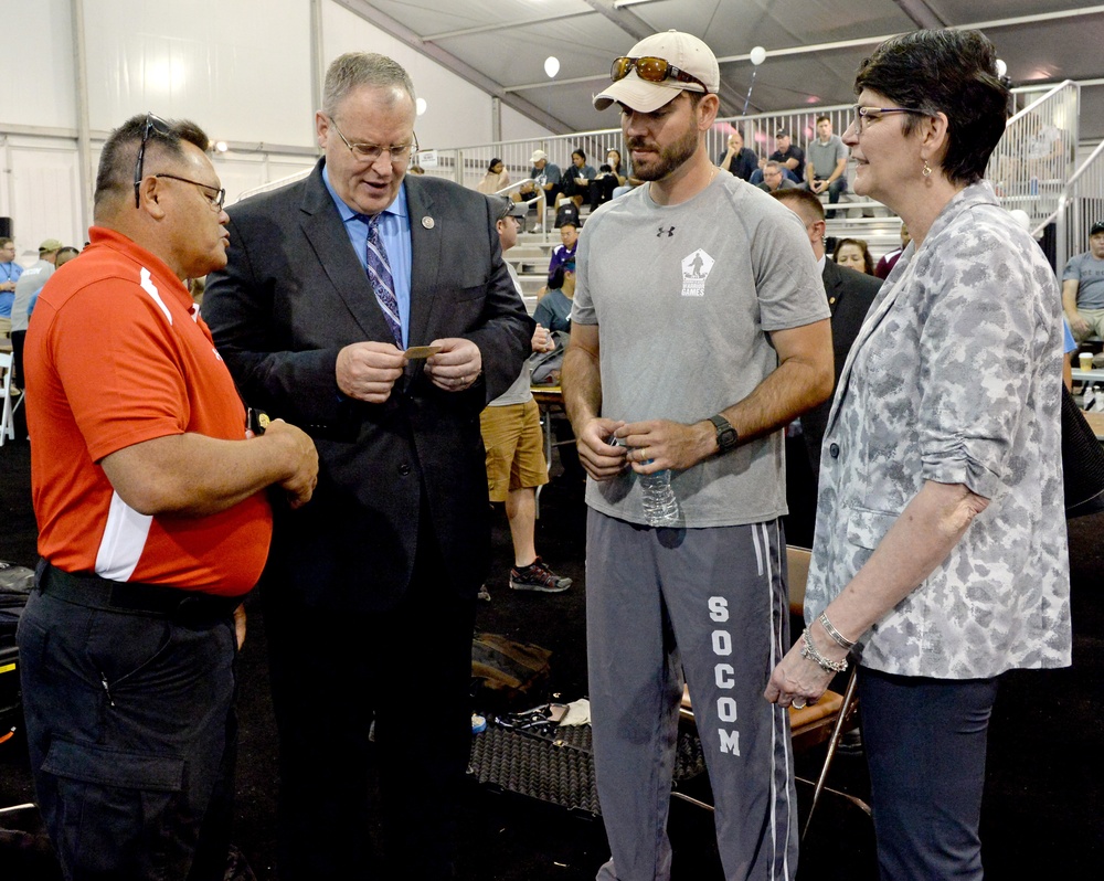 DSD Bob Work and his wife attend the 2015 Defense Department Warrior Games shooting competition