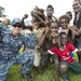 Pacific Partnership Sailors from USNS Mercy interact with local children during their arrival in Arawa, Papua New Guinea