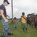 Pacific Partnership Sailors from USNS Mercy interact with local children during their arrival in Arawa, Papua New Guinea