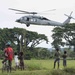 Pacific Partnership Sailors from USNS Mercy interact with local children during their arrival in Arawa, Papua New Guinea