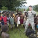 Pacific Partnership Sailors from USNS Mercy interact with local children during their arrival in Arawa, Papua New Guinea