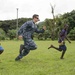 Pacific Partnership Sailors from USNS Mercy interact with local children during their arrival in Arawa, Papua New Guinea