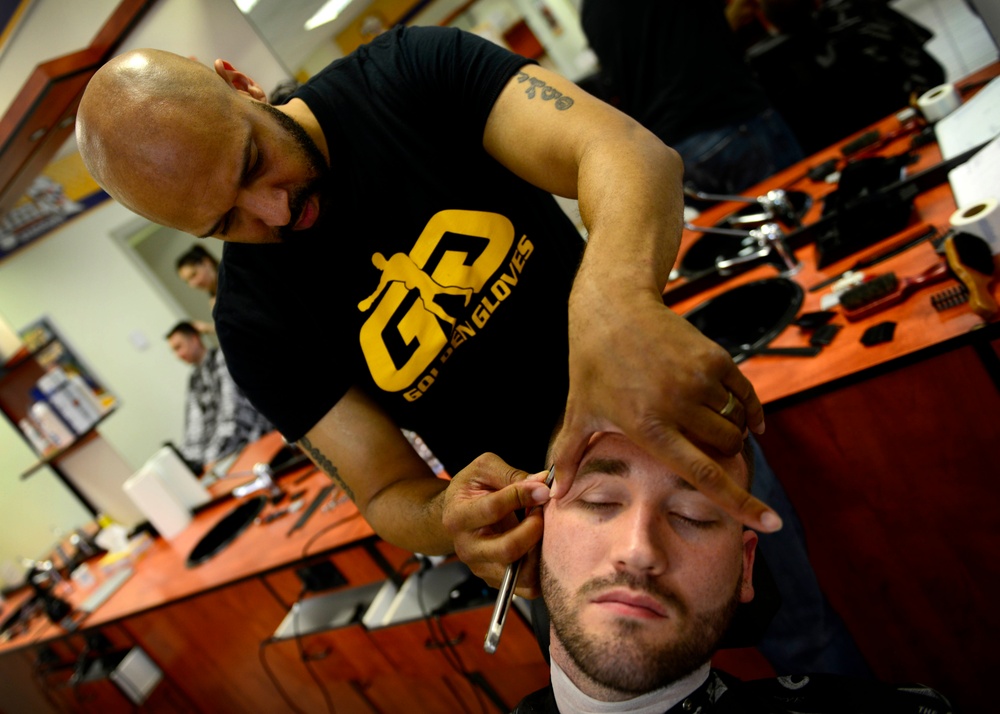 Local barber aims high, credits past