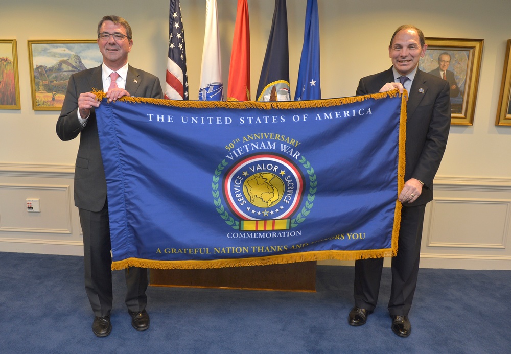 SecDef presents VA secretary with commemorative flag