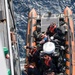 Coast Guardsmen from the Cutter Midgett from Seattle transfer of 1,232 pounds cocaine