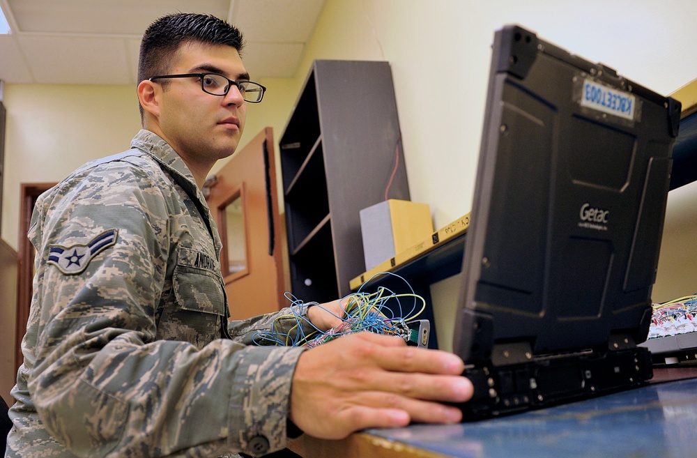 18th CMS Airmen re-wire for the Boeing modification
