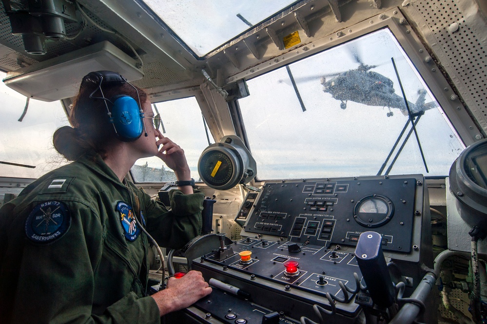 USS Antietam landing safety officer directs takeoff