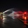 Fire trucks spray UTANG flight line