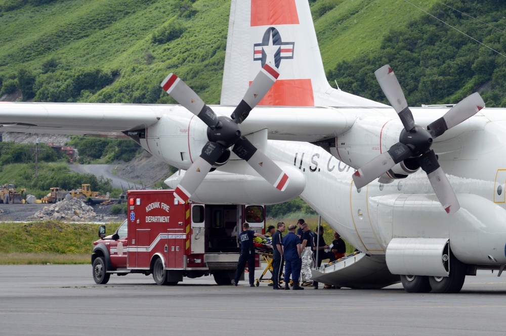 Air Station Kodiak C-130 aircrew transfers patient to Kodiak EMS