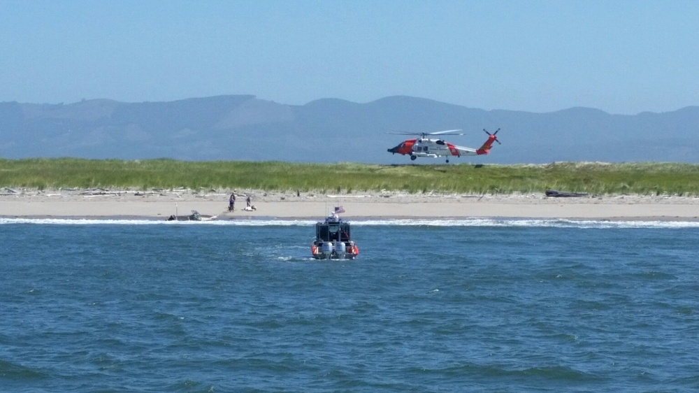 Coast Guard rescues 2 from grounded vessel near Sand Island, Wash.