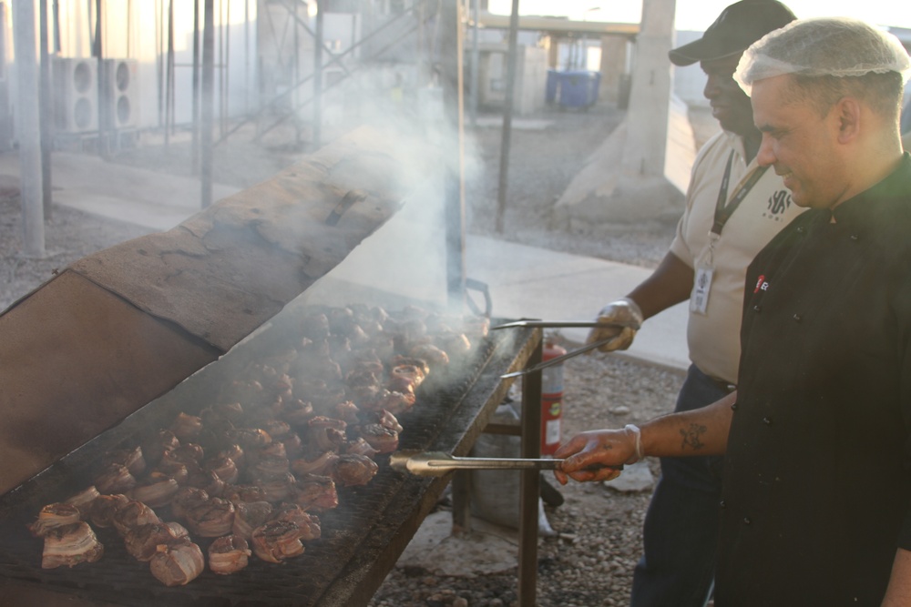 Marines at Al-Taqaddum Airbase receive a special meal in celebration of Independence Day