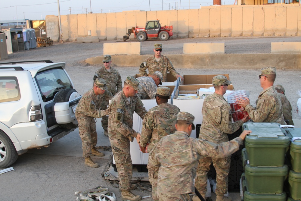 Marines at Al-Taqaddum Airbase receive a special meal in celebration of Independence Day