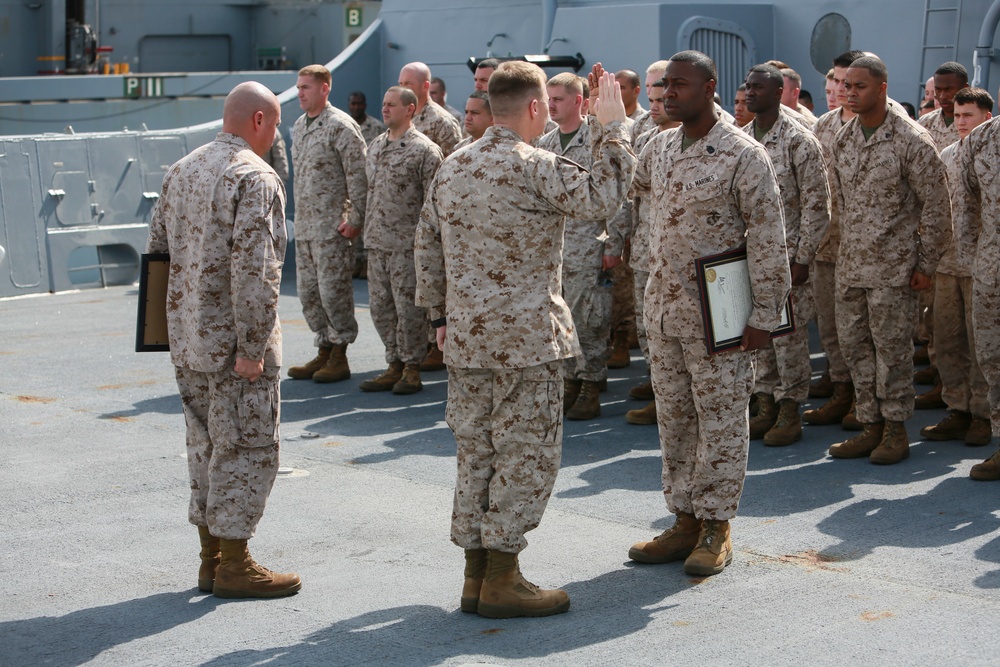 U.S. Marines get promoted aboard Anchorage