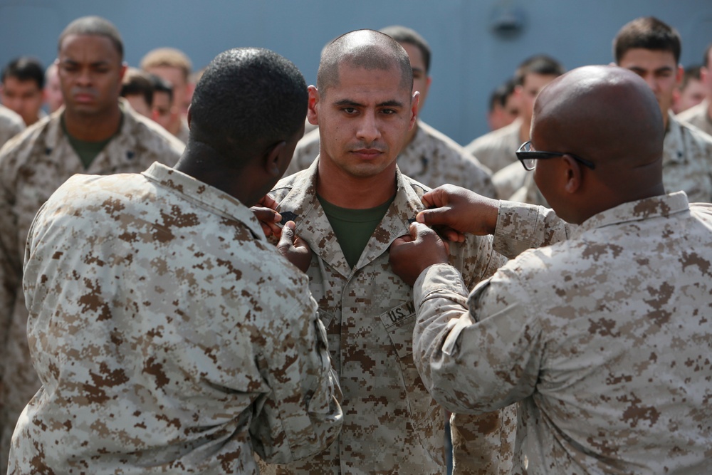 U.S. Marines get promoted aboard Anchorage