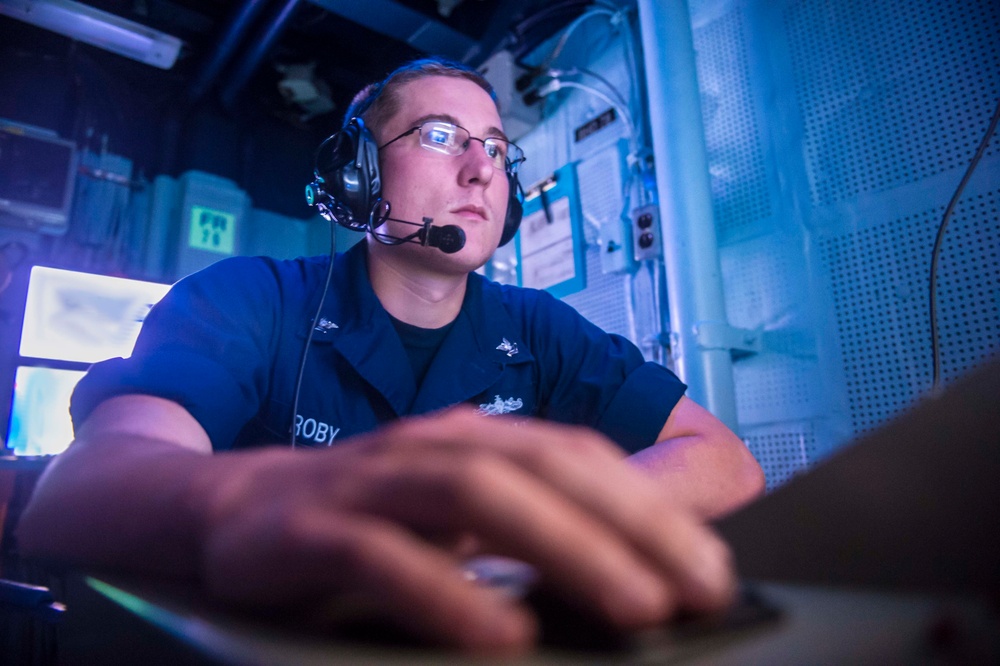 Standing watch in USS Mustin's sonar control center during Talisman Sabre 2015