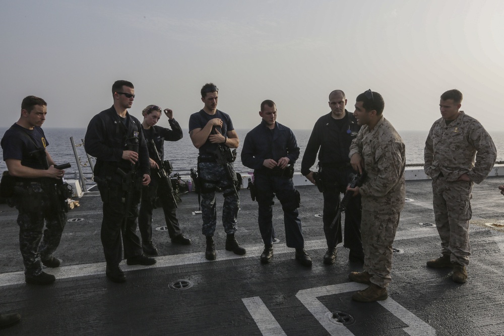 U.S. Marines guide Sailors during VBSS training