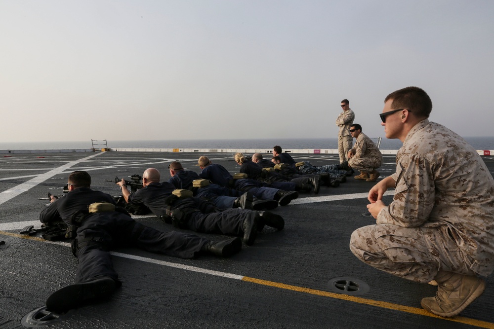 U.S. Marines guide Sailors during VBSS training