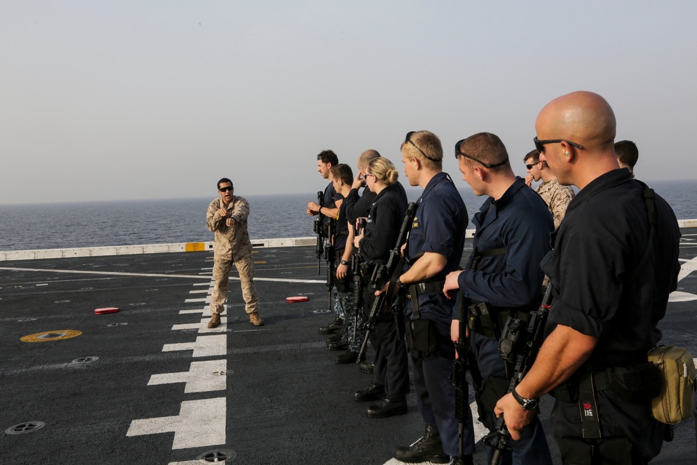 U.S. Marines guide Sailors during VBSS training