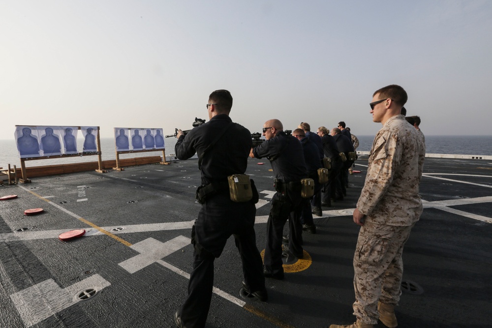 U.S. Marines guide Sailors during VBSS training