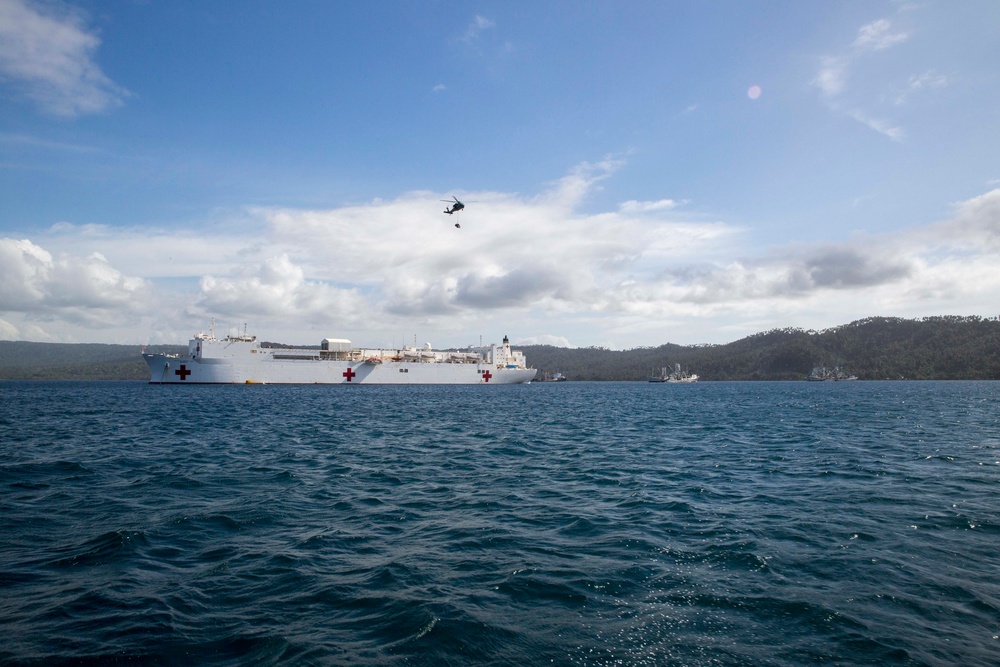 USNS Mercy brings patients aboard in Rabual